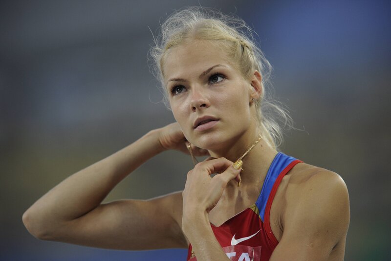 Female Athlete Adjusting Necklace