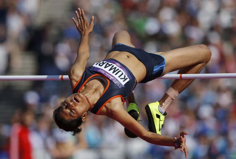 Female Athlete Jumping — Blue, Intense