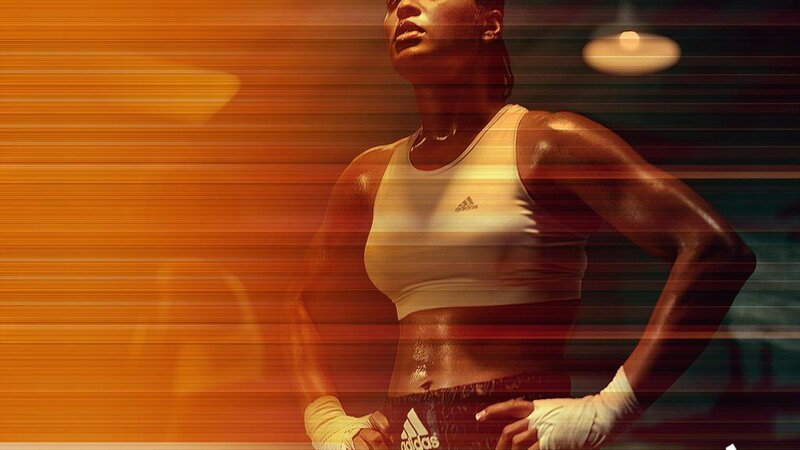 Female Boxer in Gym — Orange