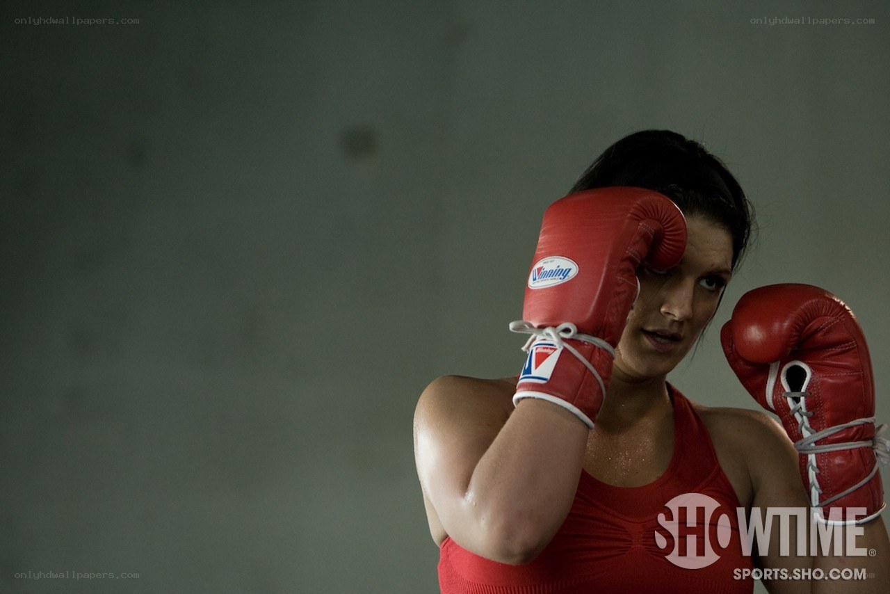 female boxer in red gloves