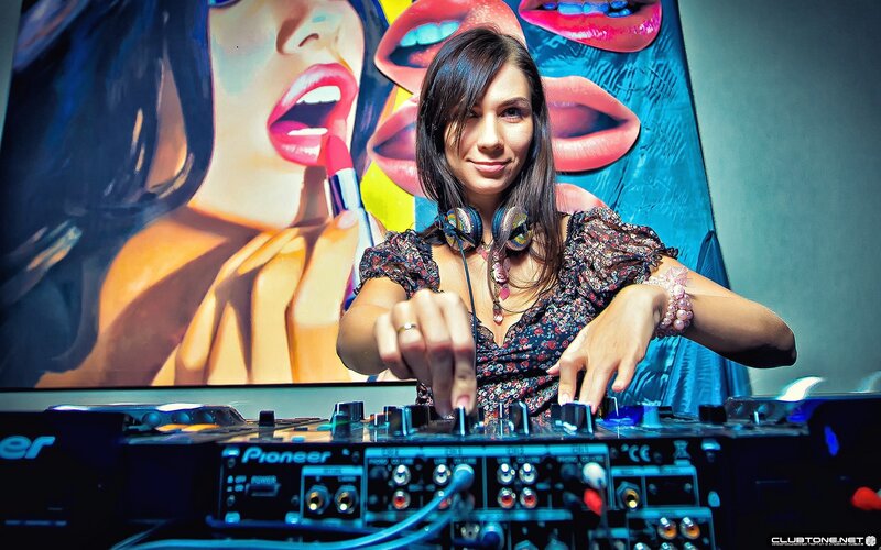 Female DJ at Turntables — Blue, Confident