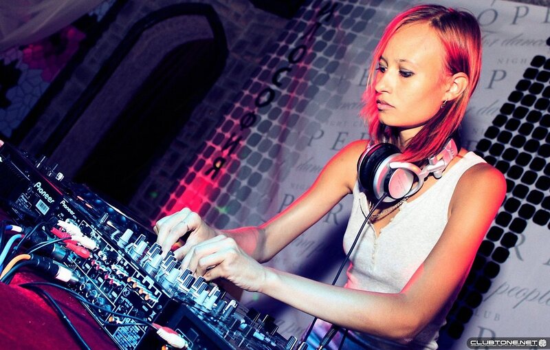 female dj performing at club