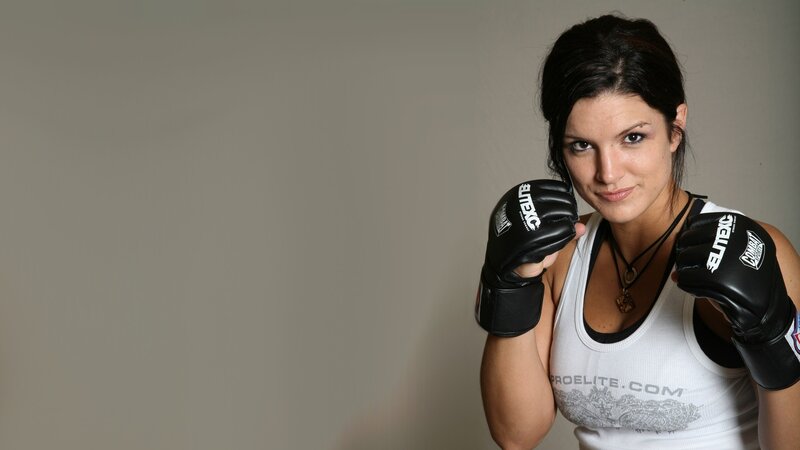 female fighter in boxing gloves