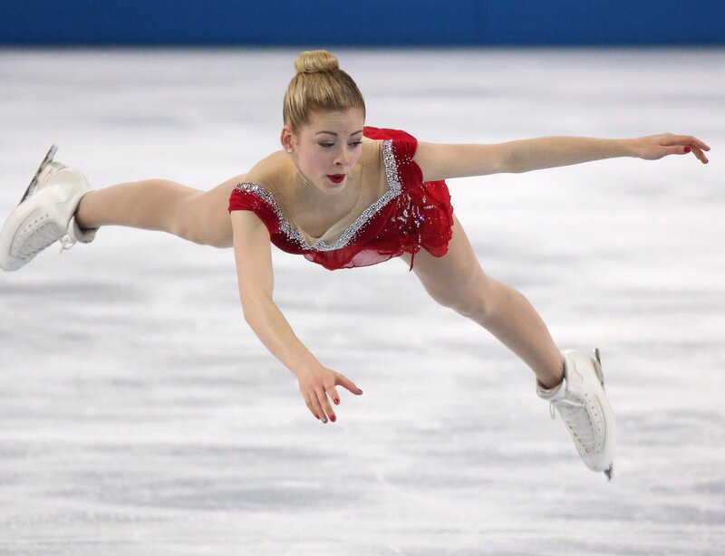 Female Figure Skater — White, Focused, Photograph