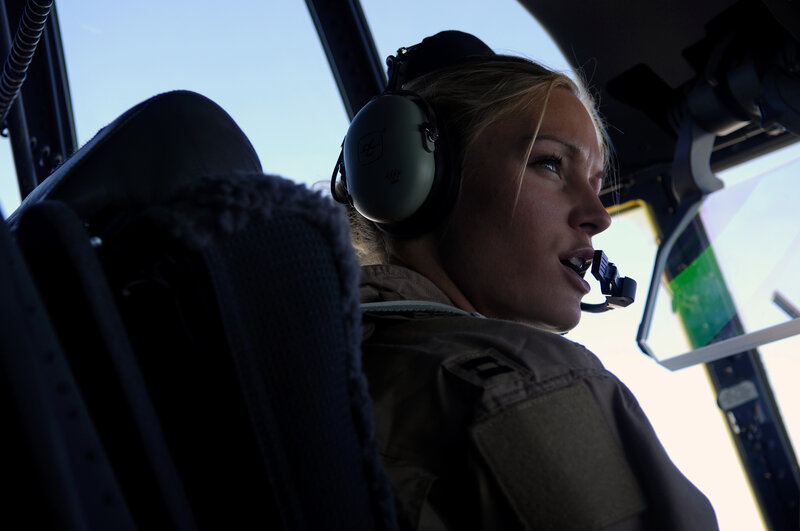 female pilot in helicopter cockpit