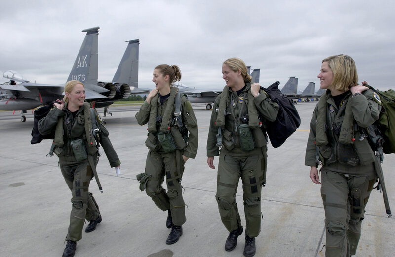 Female pilots walking on airfield