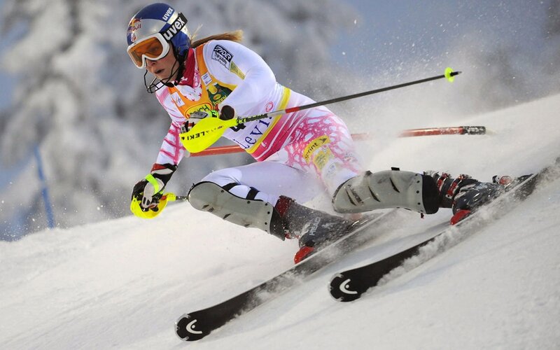 Female Skier in Action — White, Dynamic, Winter, Photograph, Skis, Goggles