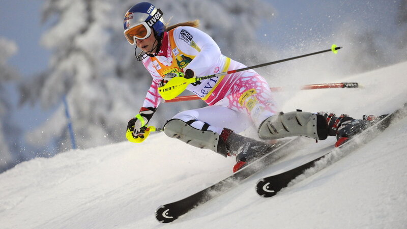 Female Skier in Action — White