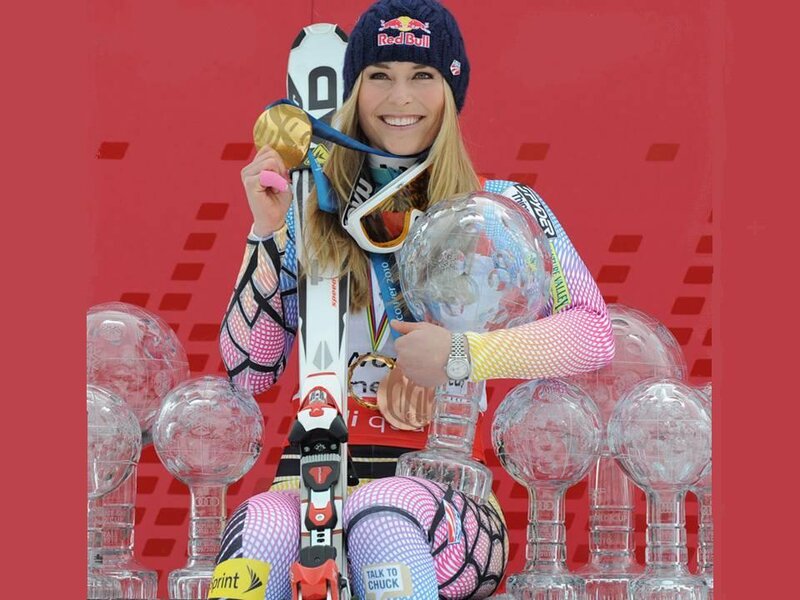 Female Skier with Trophies