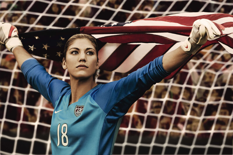 Female soccer goalie with flag