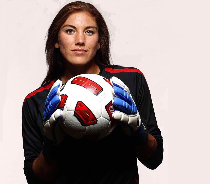 female soccer goalkeeper holding ball