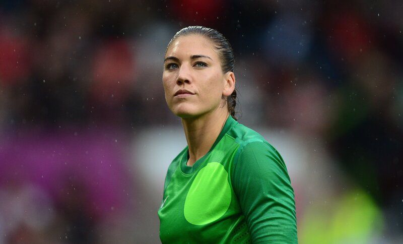 Female Soccer Player — Green, Focused