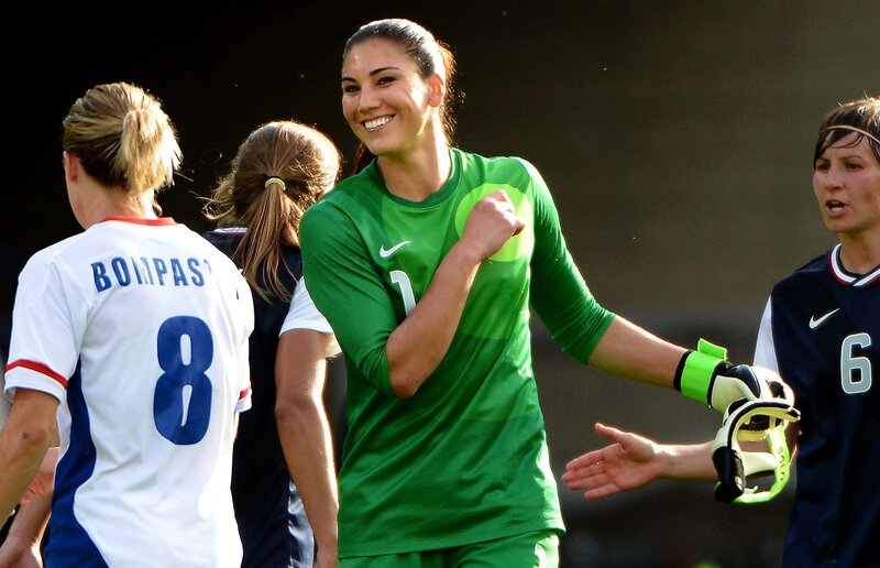 Female soccer players celebrating