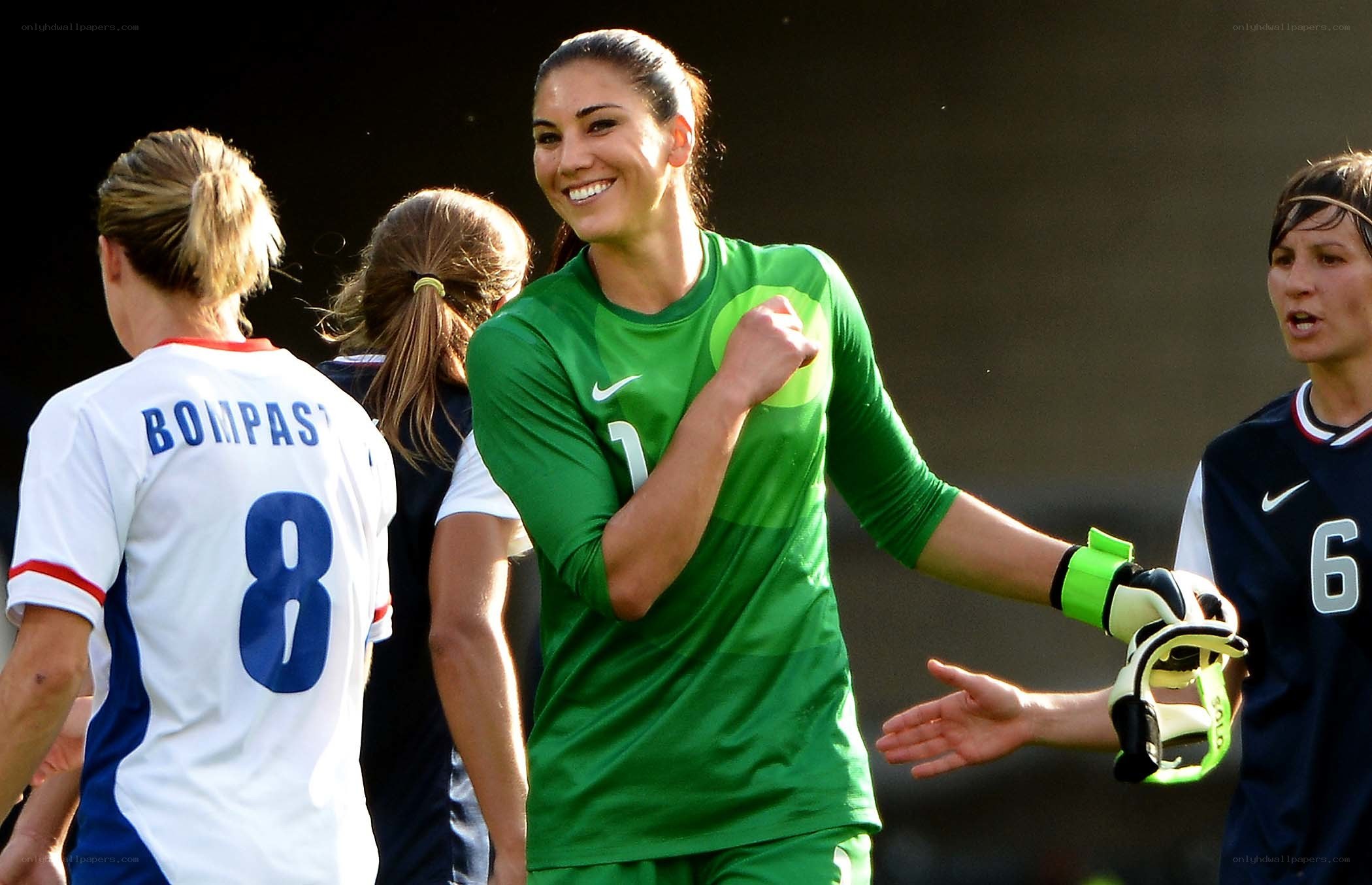 Female soccer players celebrating
