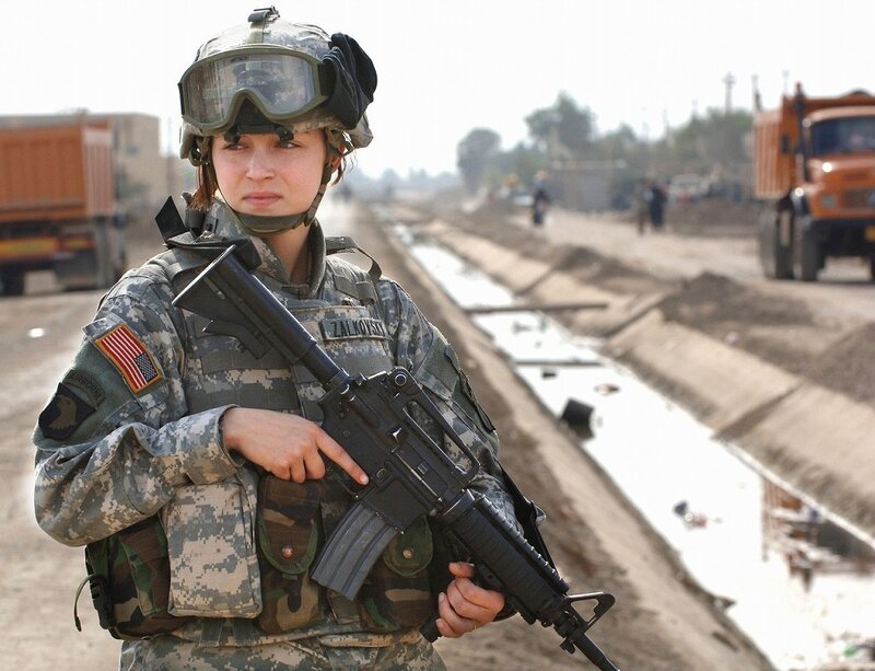Female soldier in combat gear