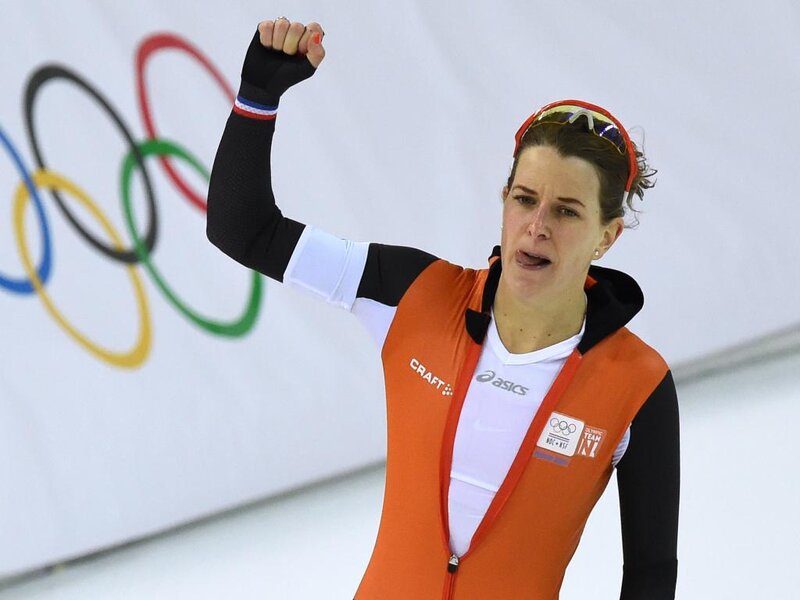 Female Speed Skater — Orange, Celebratory
