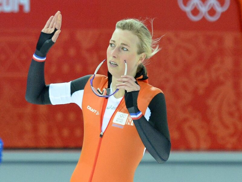 Female Speed Skater — Orange, Focused, Photograph, Olympic Rings