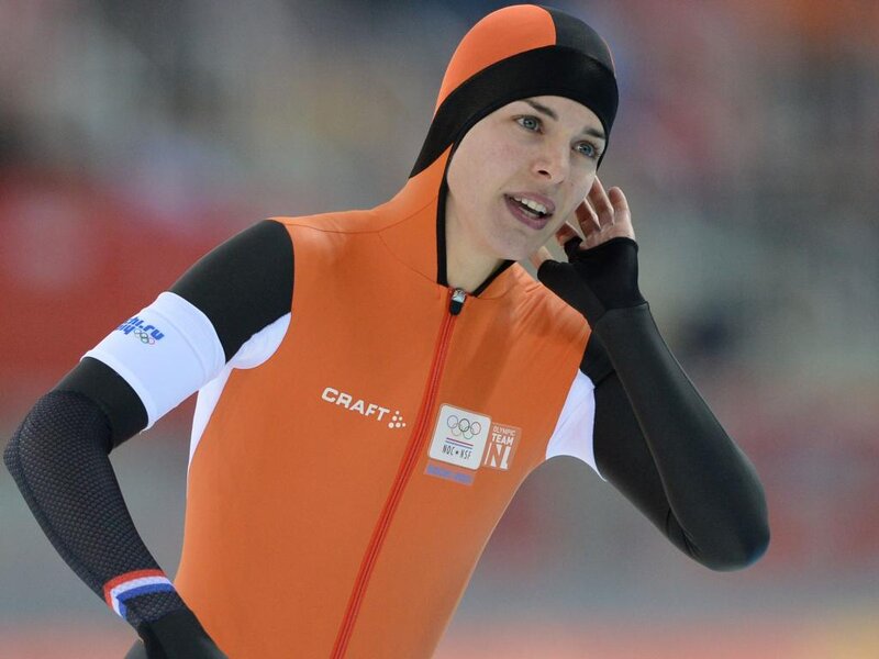 Female Speed Skater — Orange, Focused, Photograph, Orange Suit