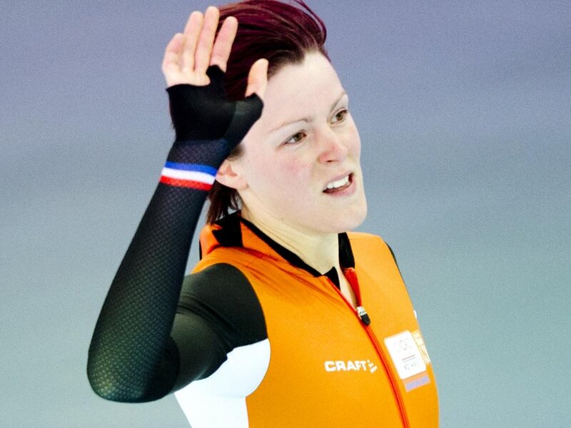 Female Speed Skater — Orange, Focused, Photograph, Orange Vest