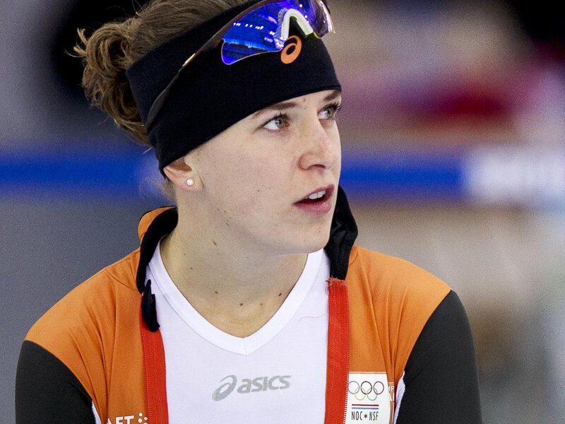 Female Speed Skater — Orange, Focused