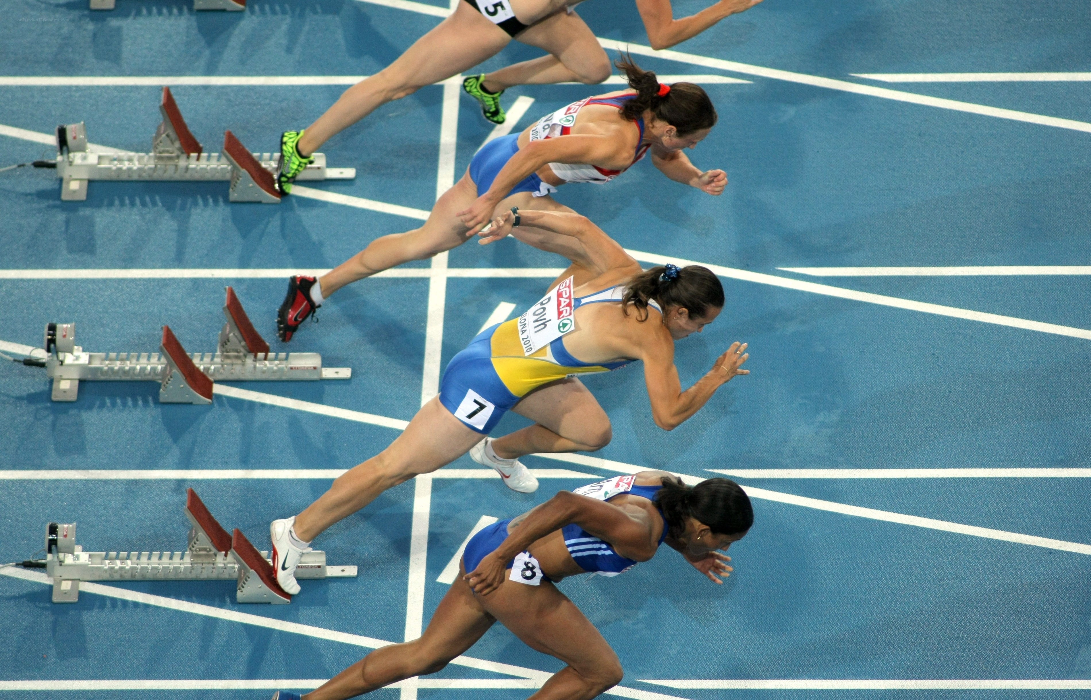 Female sprinters at start line