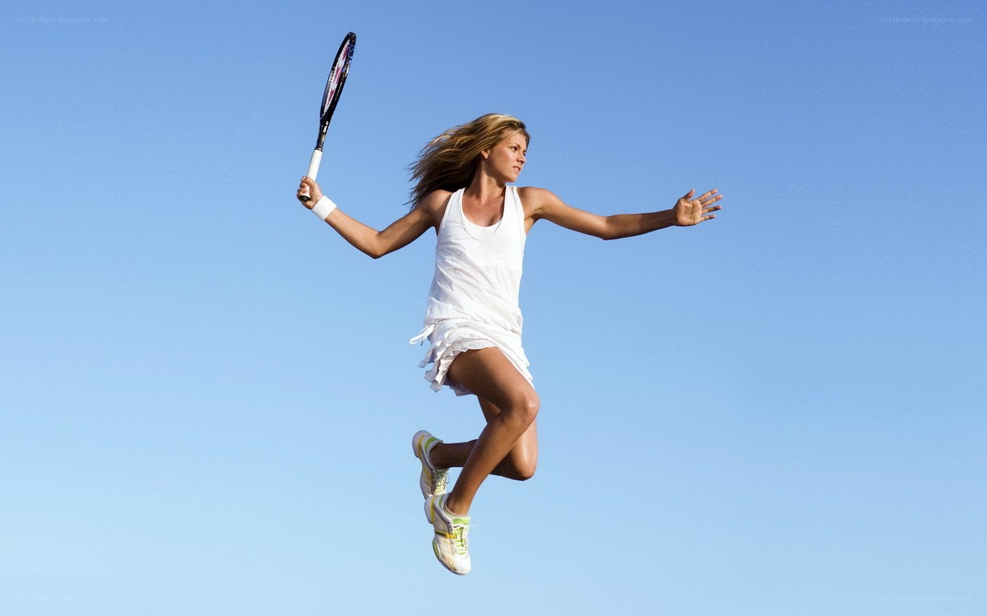 female tennis player jumping