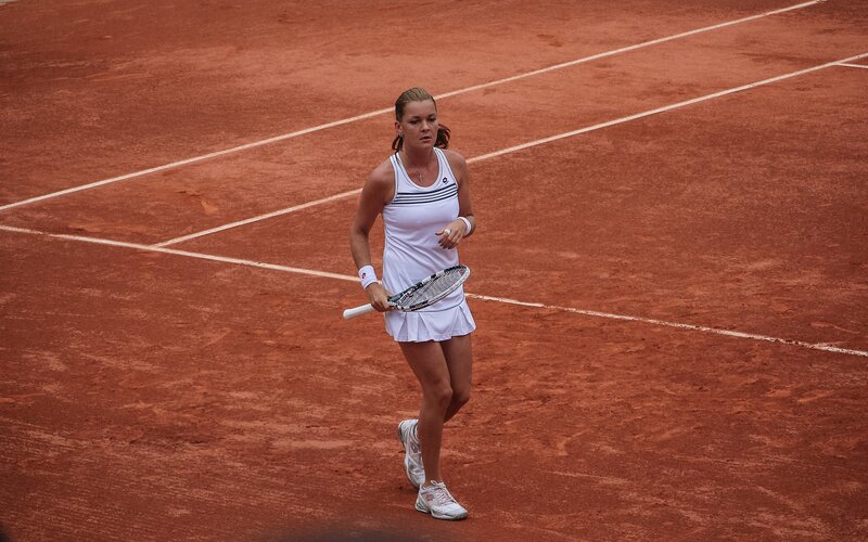 Female Tennis Player — Red, Focused, Afternoon