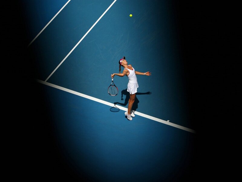 Female Tennis Player Serving — Blue