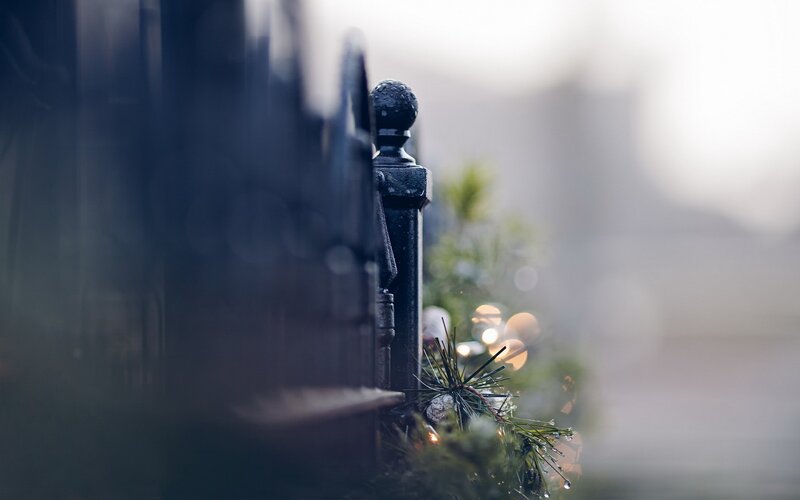 fence with holiday lights