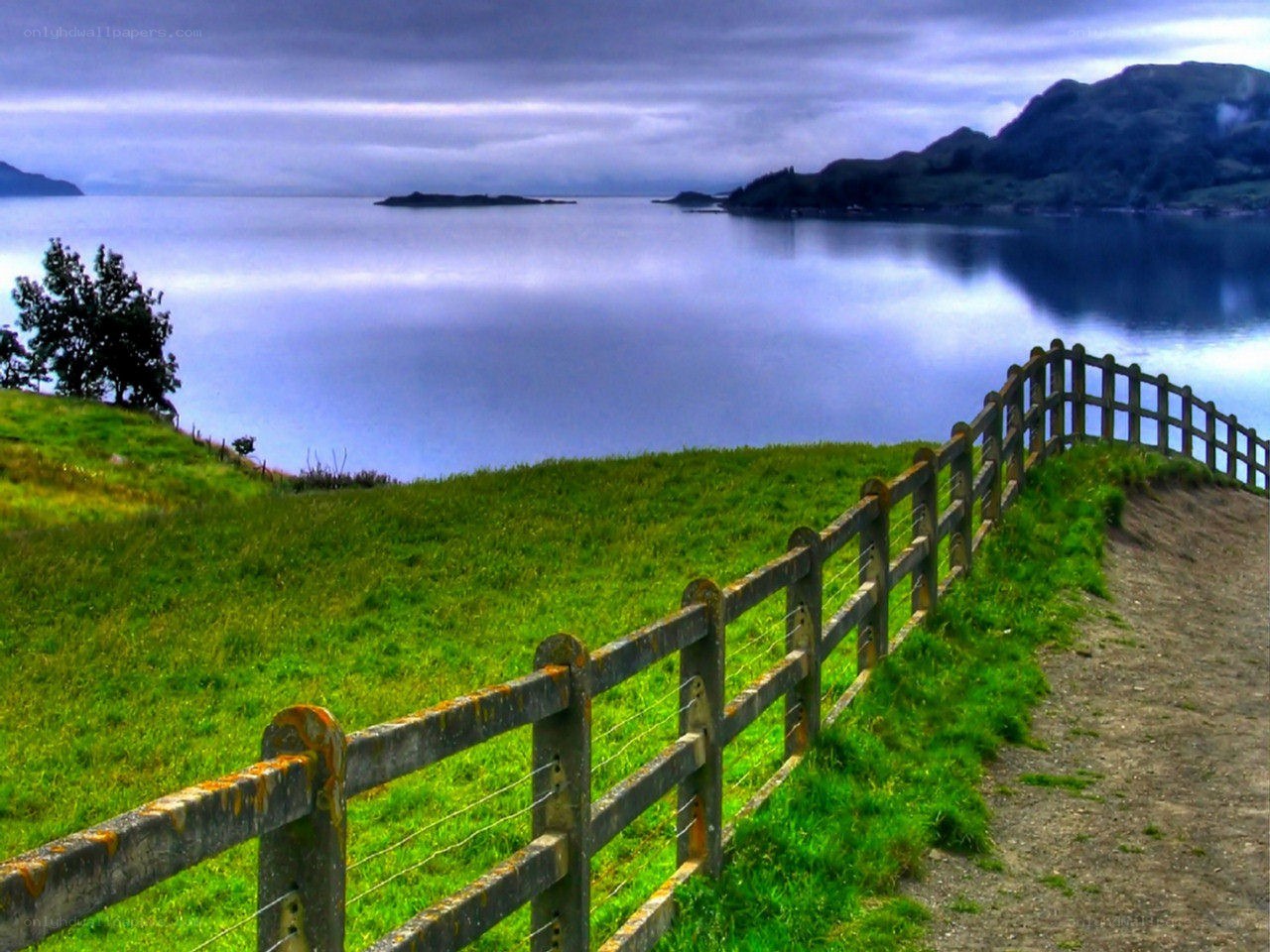 Fenced path by a coastal loch