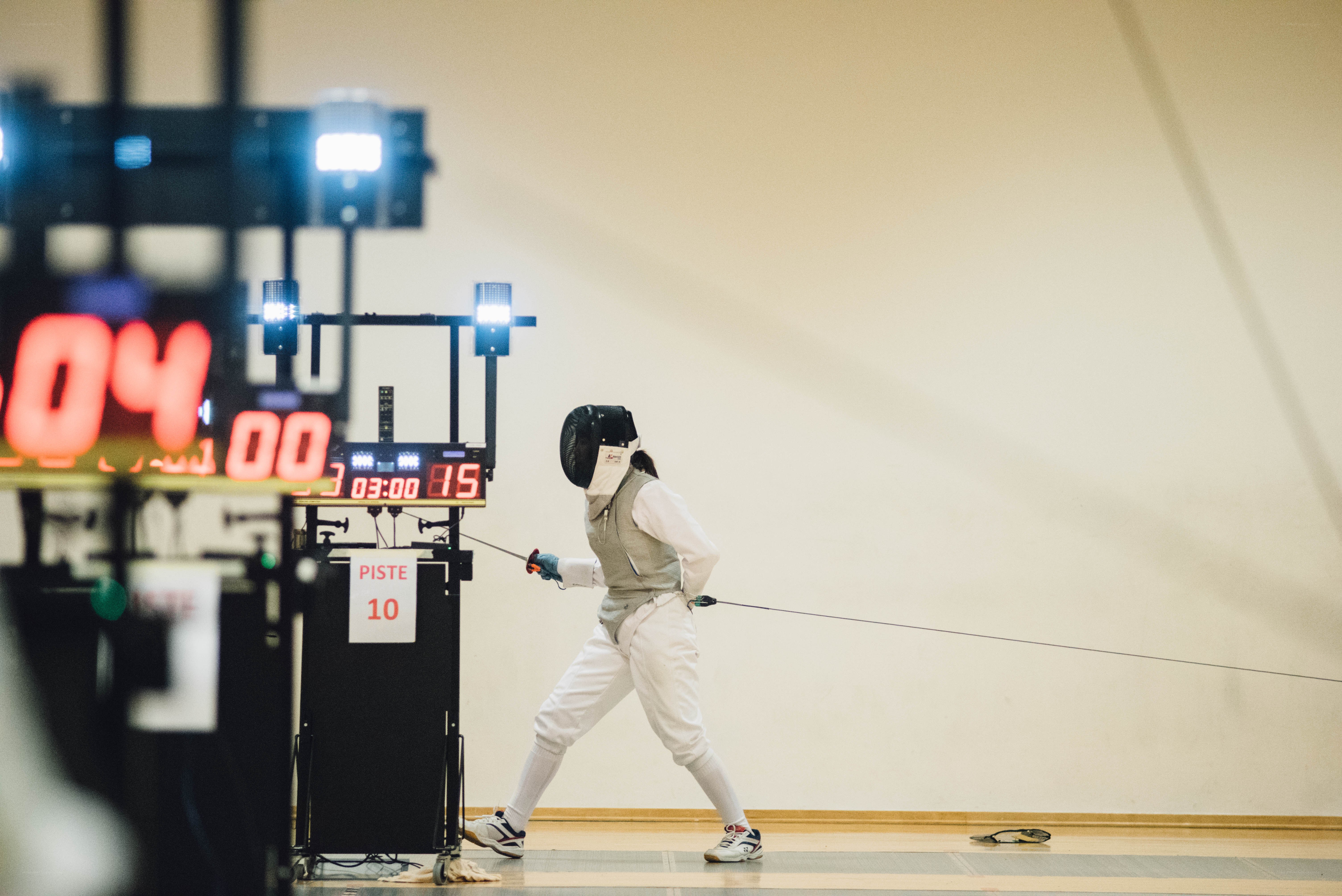 Fencer in action on piste