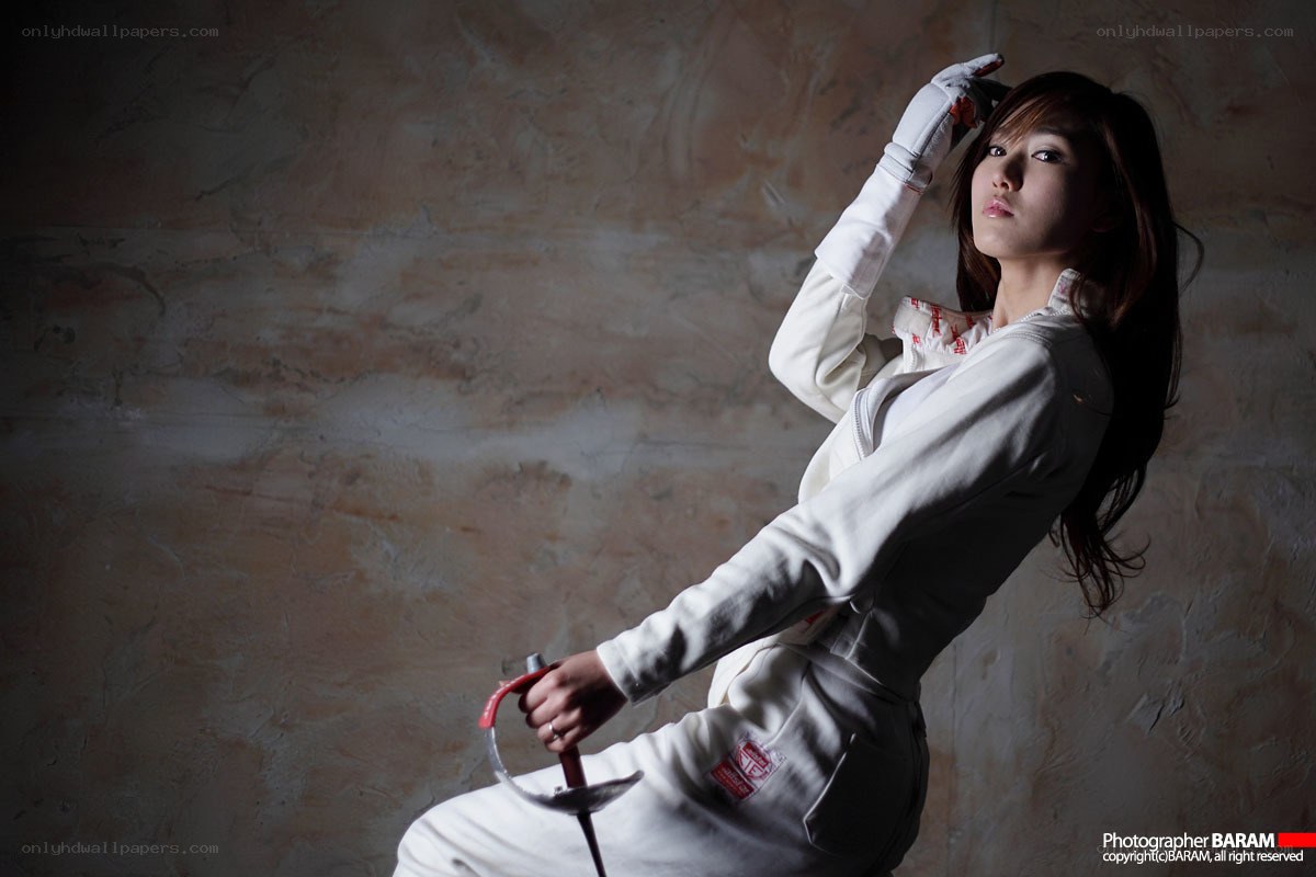 fencing athlete in white uniform