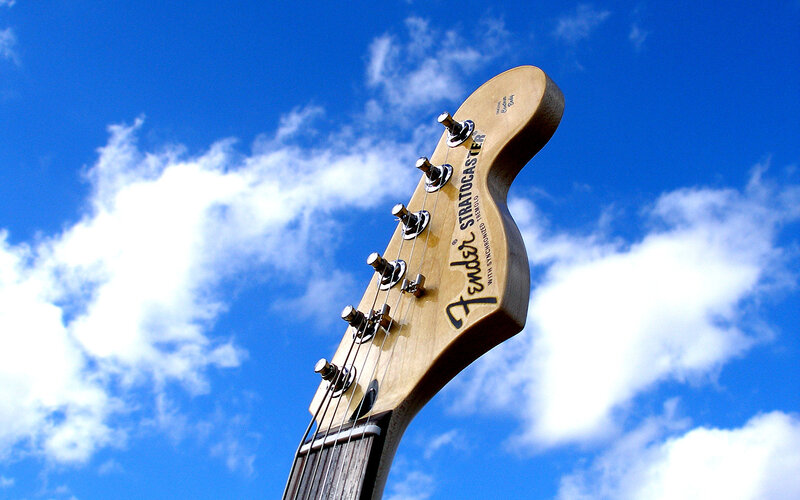 Fender Stratocaster headstock against sky