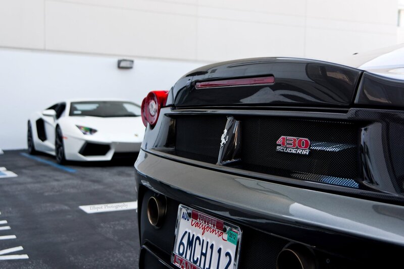 Ferrari and Lamborghini in parking lot