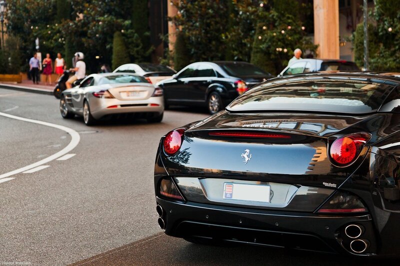 Ferrari and luxury cars on street