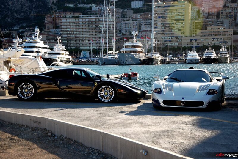 Ferrari and Maserati at a marina