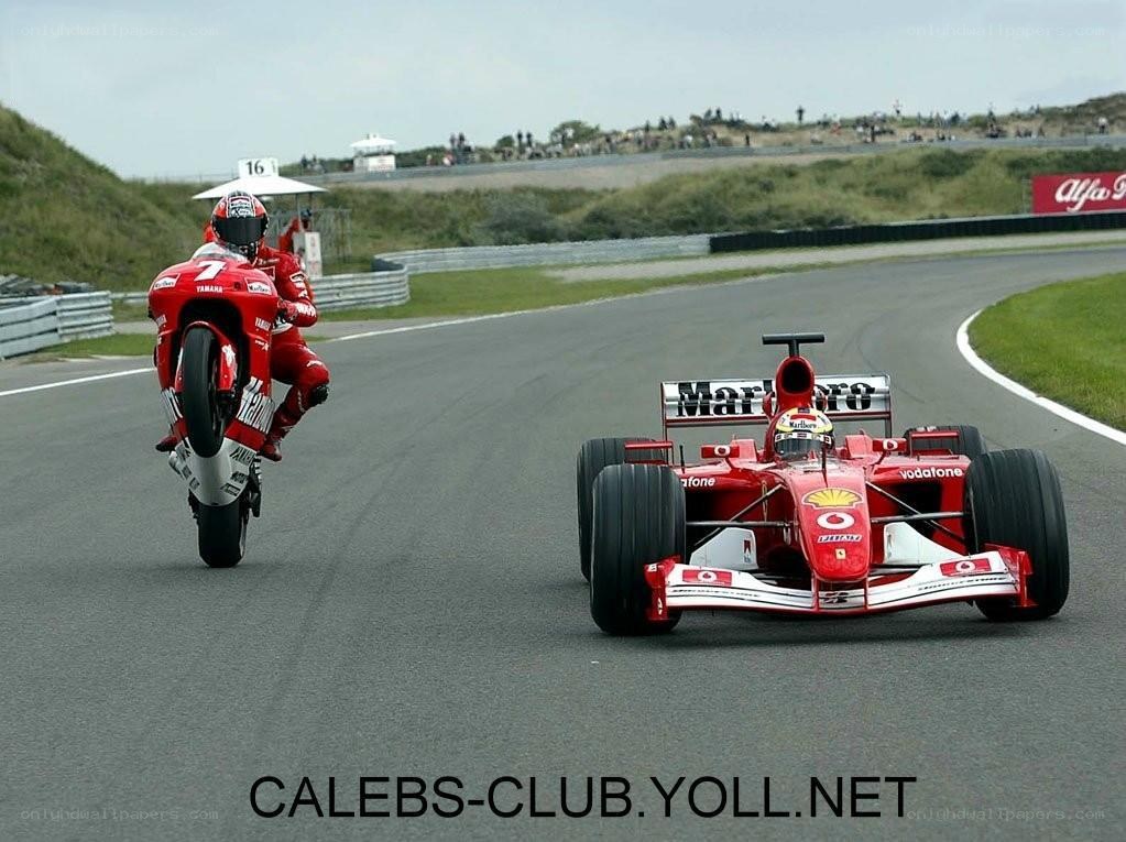 Ferrari and motorcycle on track
