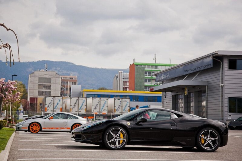 Ferrari and Porsche in parking lot