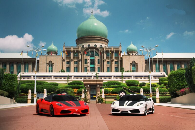 Ferrari cars in front of a palace