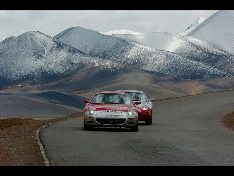 Ferrari cars on a mountain road