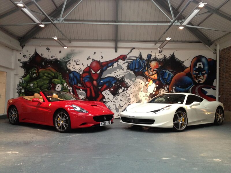 Ferrari cars with superhero mural