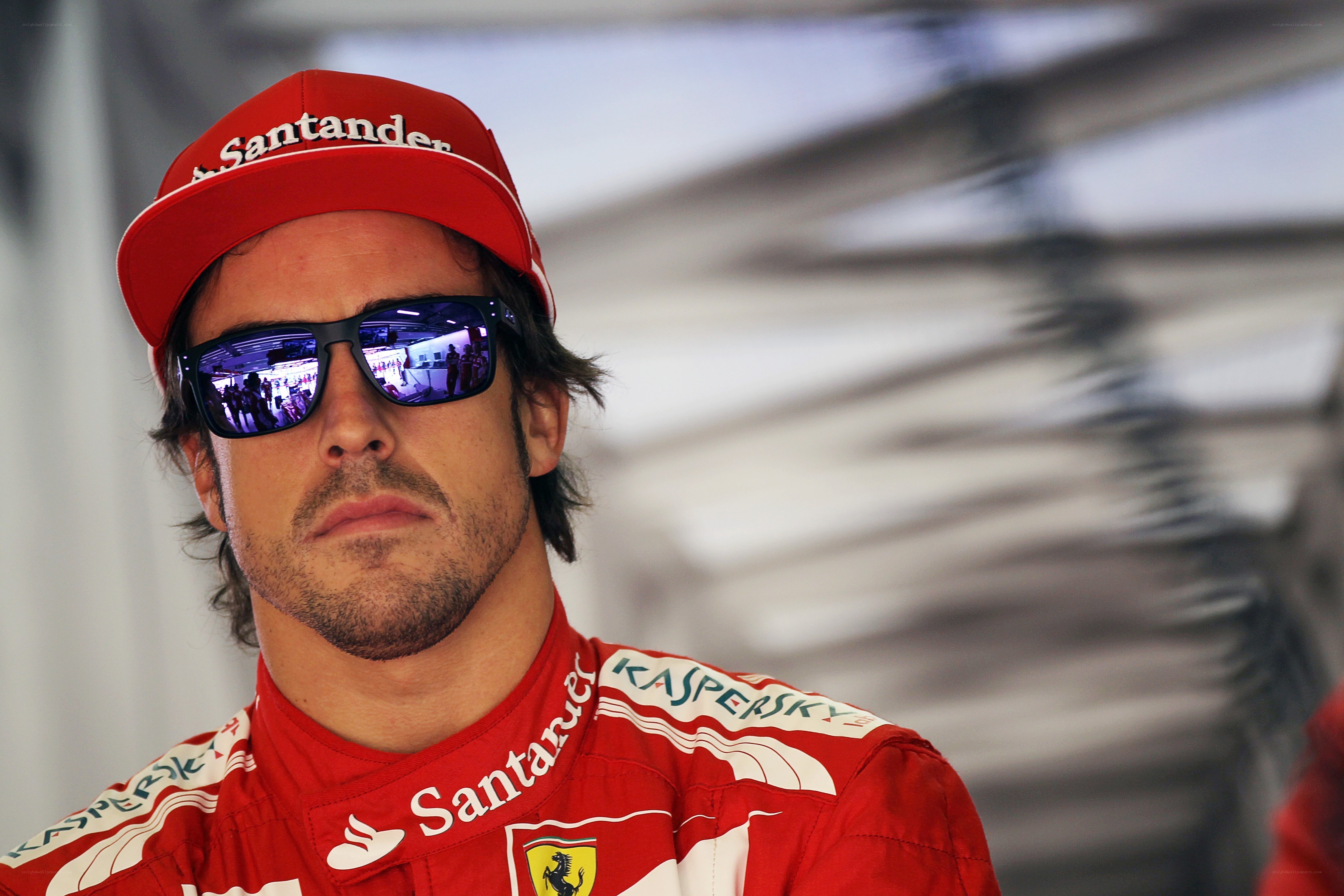 Ferrari driver in red suit
