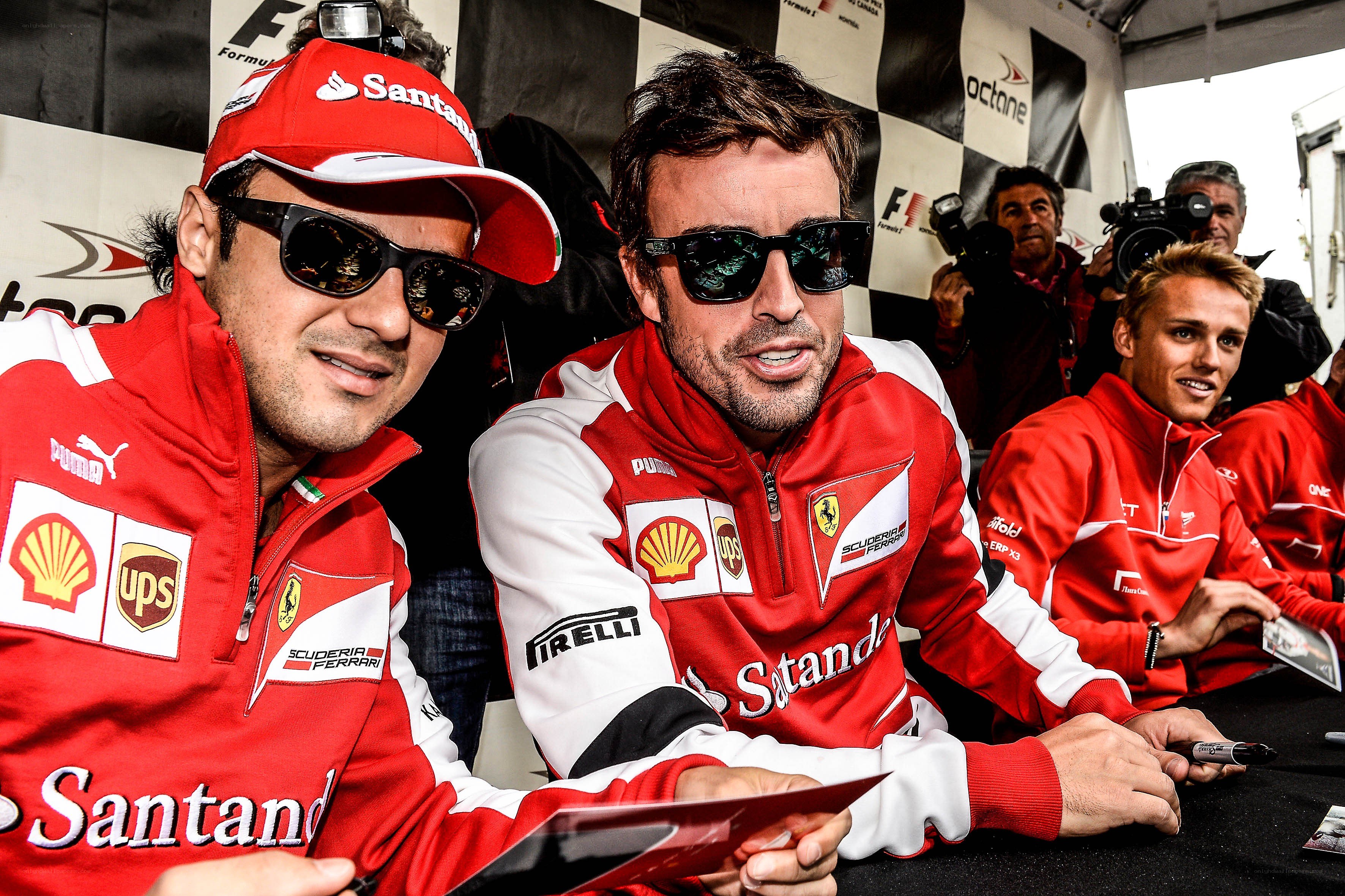 Ferrari drivers signing autographs