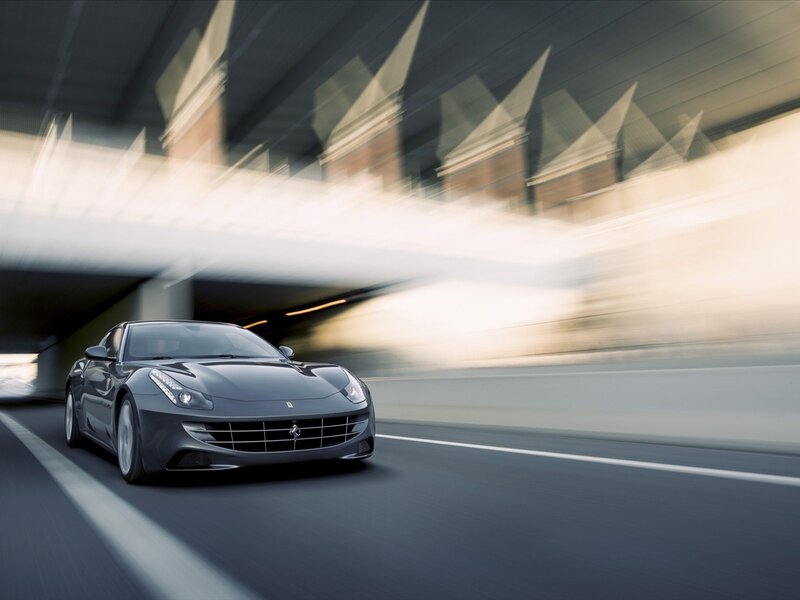 Ferrari driving on a road