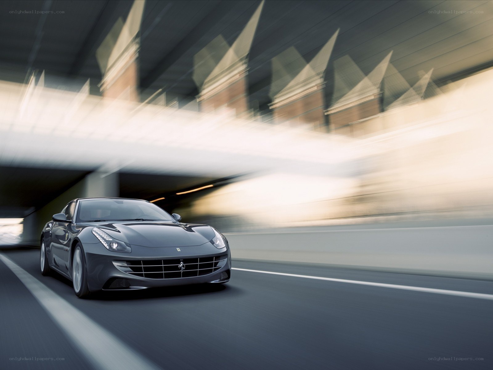 Ferrari driving on a road