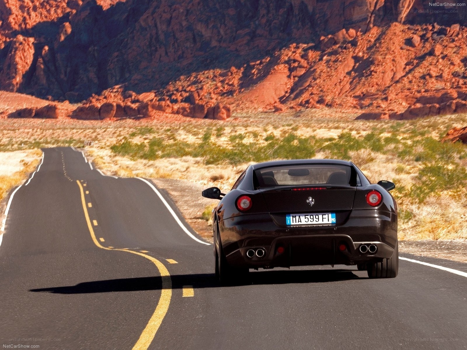 Ferrari driving on desert road