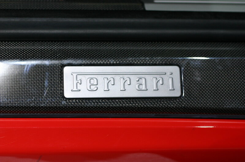 Ferrari emblem on carbon fiber