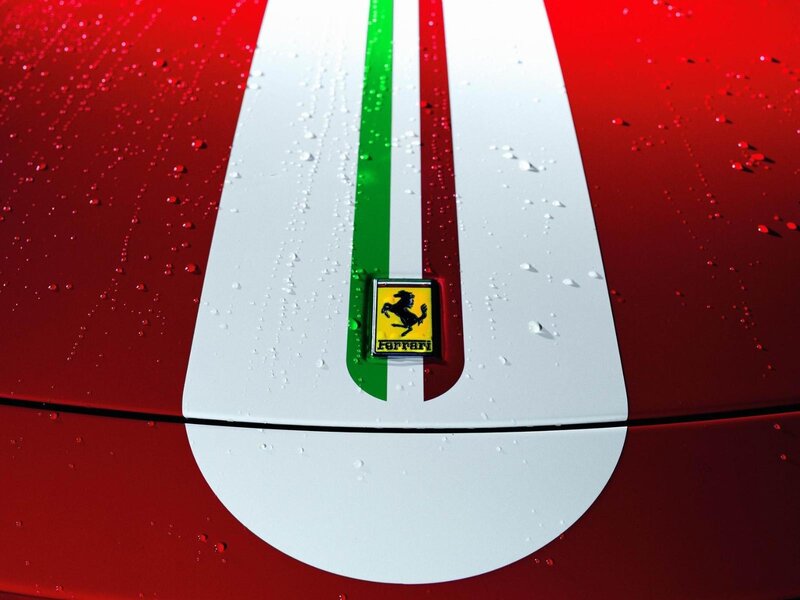 Ferrari emblem on red car