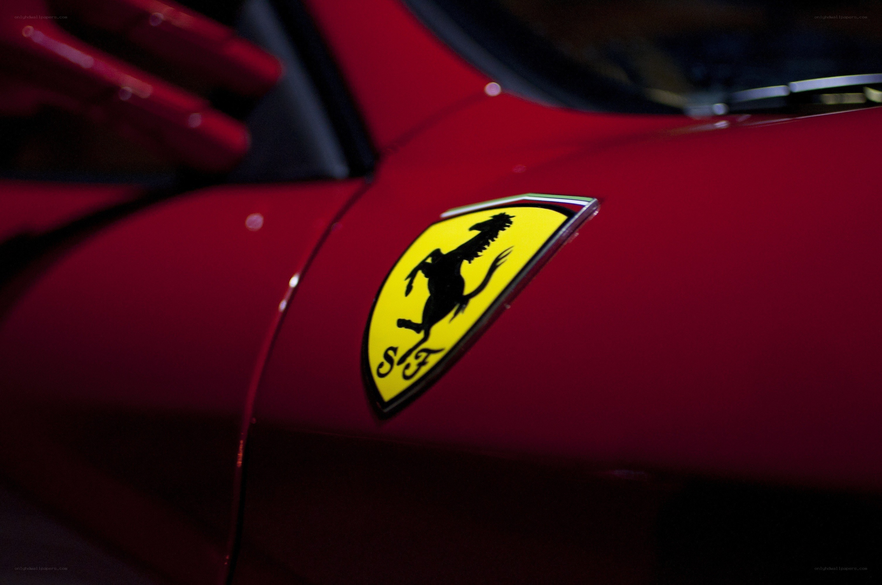 Ferrari emblem on red car