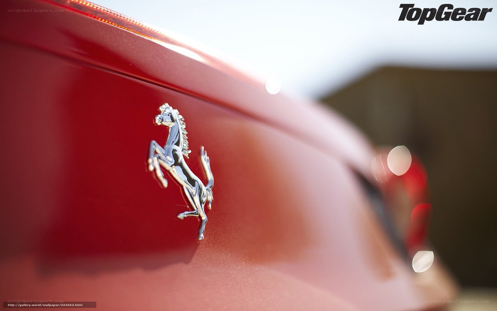 Ferrari emblem on red car
